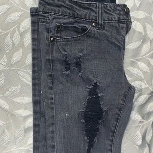 Miley Cyrus distressed skinny jeans